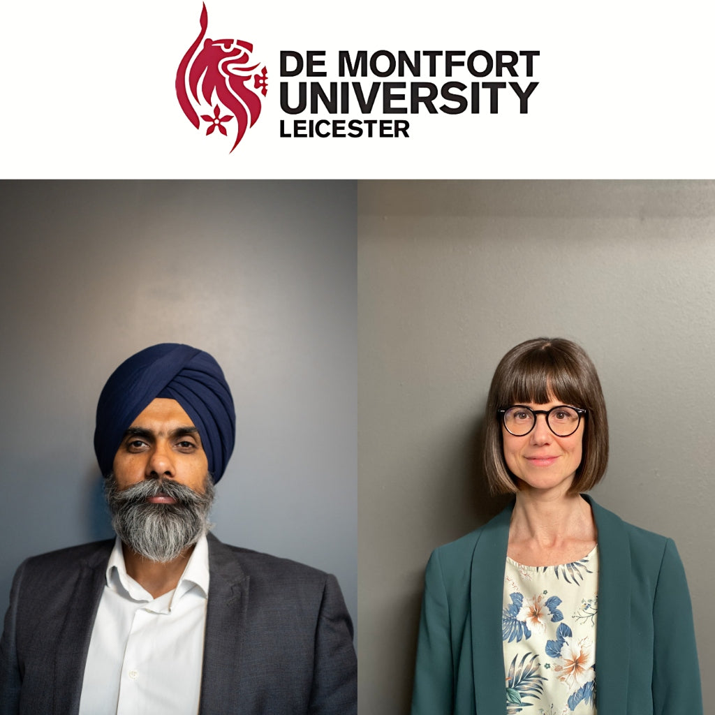 Two individuals, a man and a woman, standing in front of a De Montfort University Leicester logo.