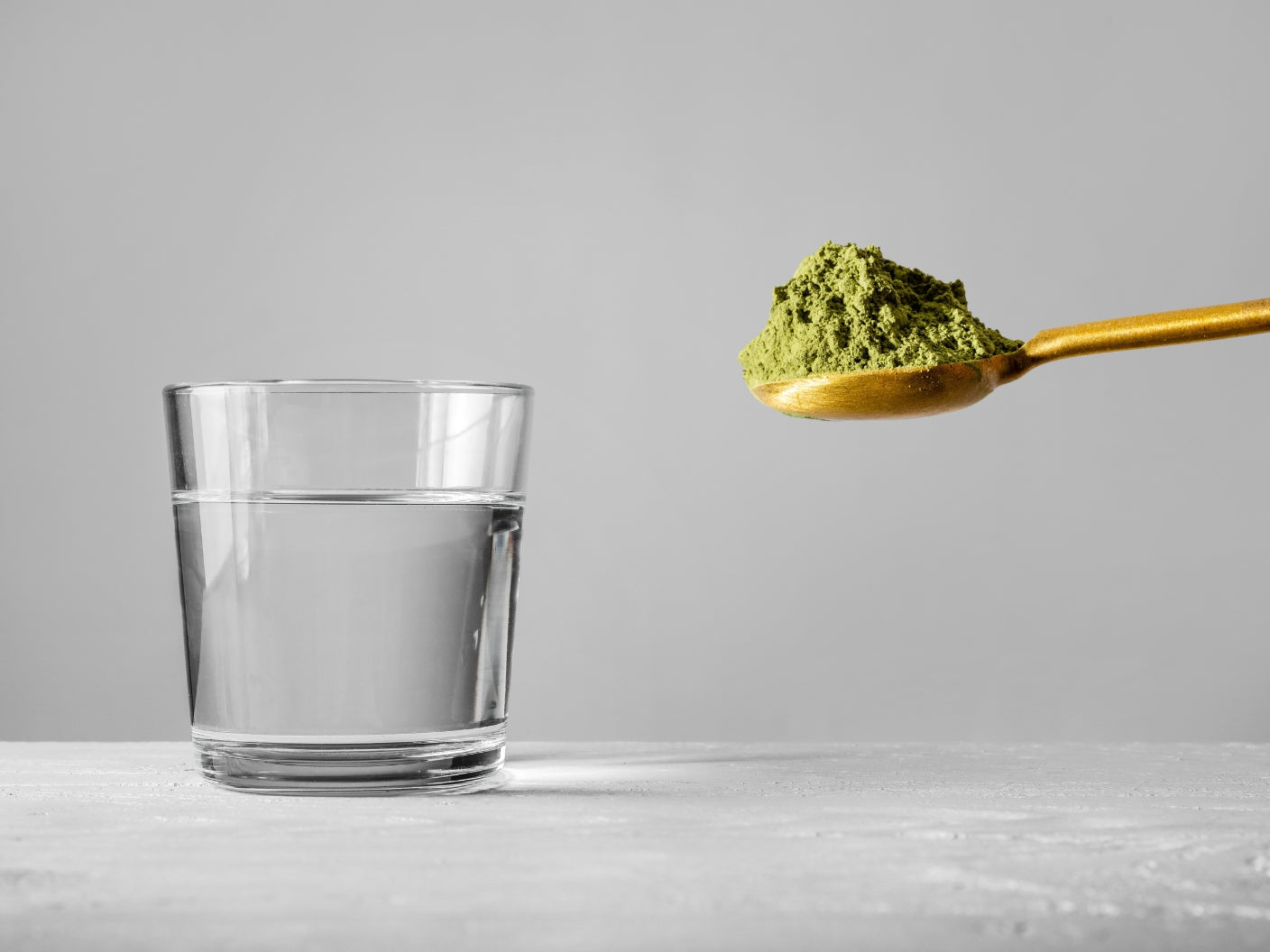 Round green spice blend on a white background