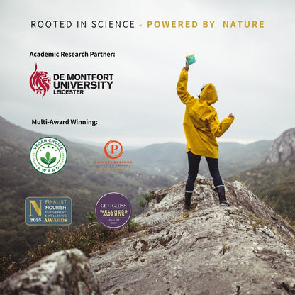 Science backed greens with multiple awards. Woman holding sachet in image