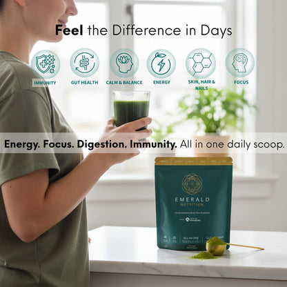Person holding a glass of green juice next to a bag of Emerald Nutrition powder with health benefits listed.