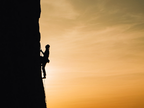 Man climbing mountain