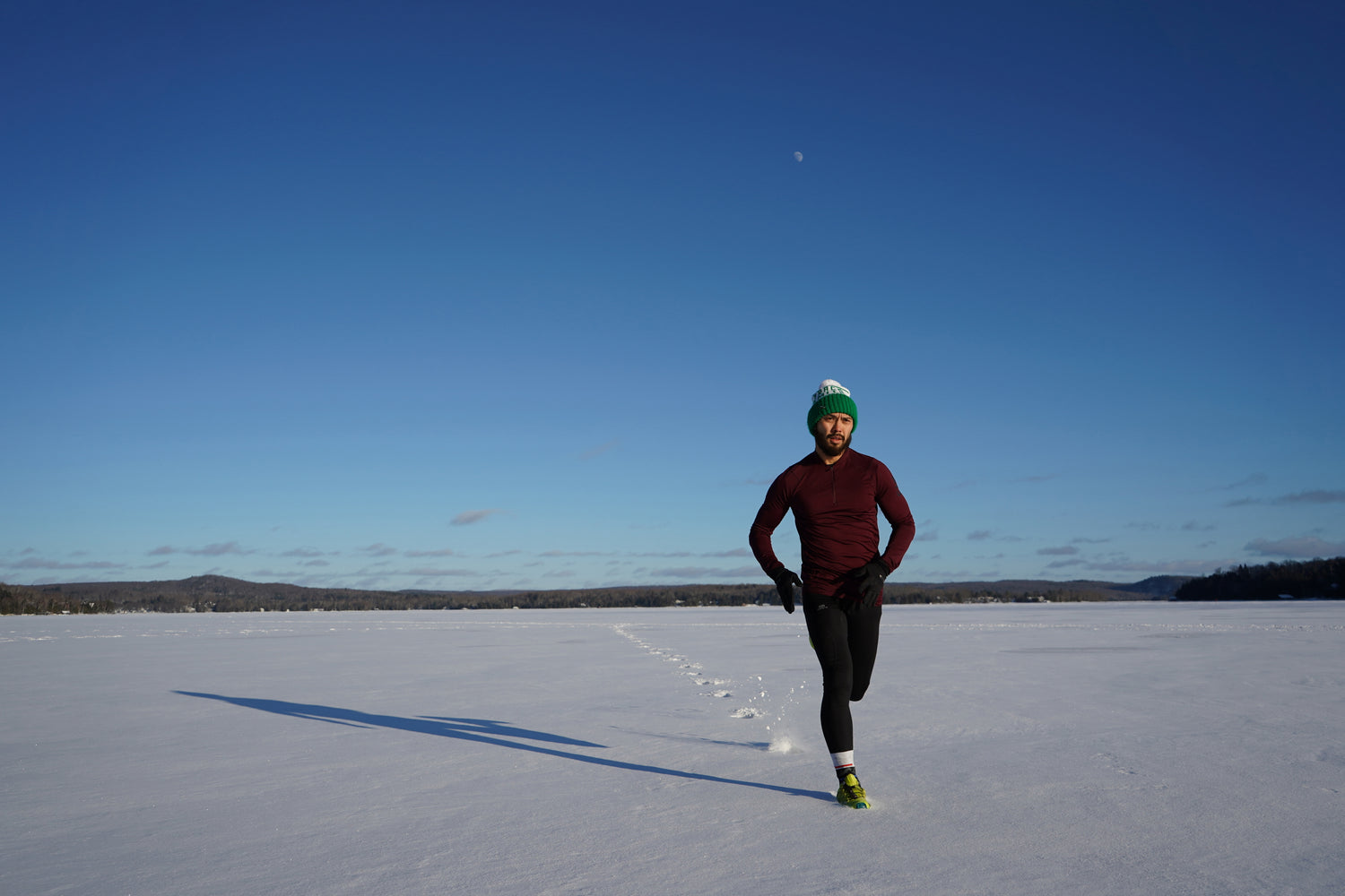 Image of man running through snow