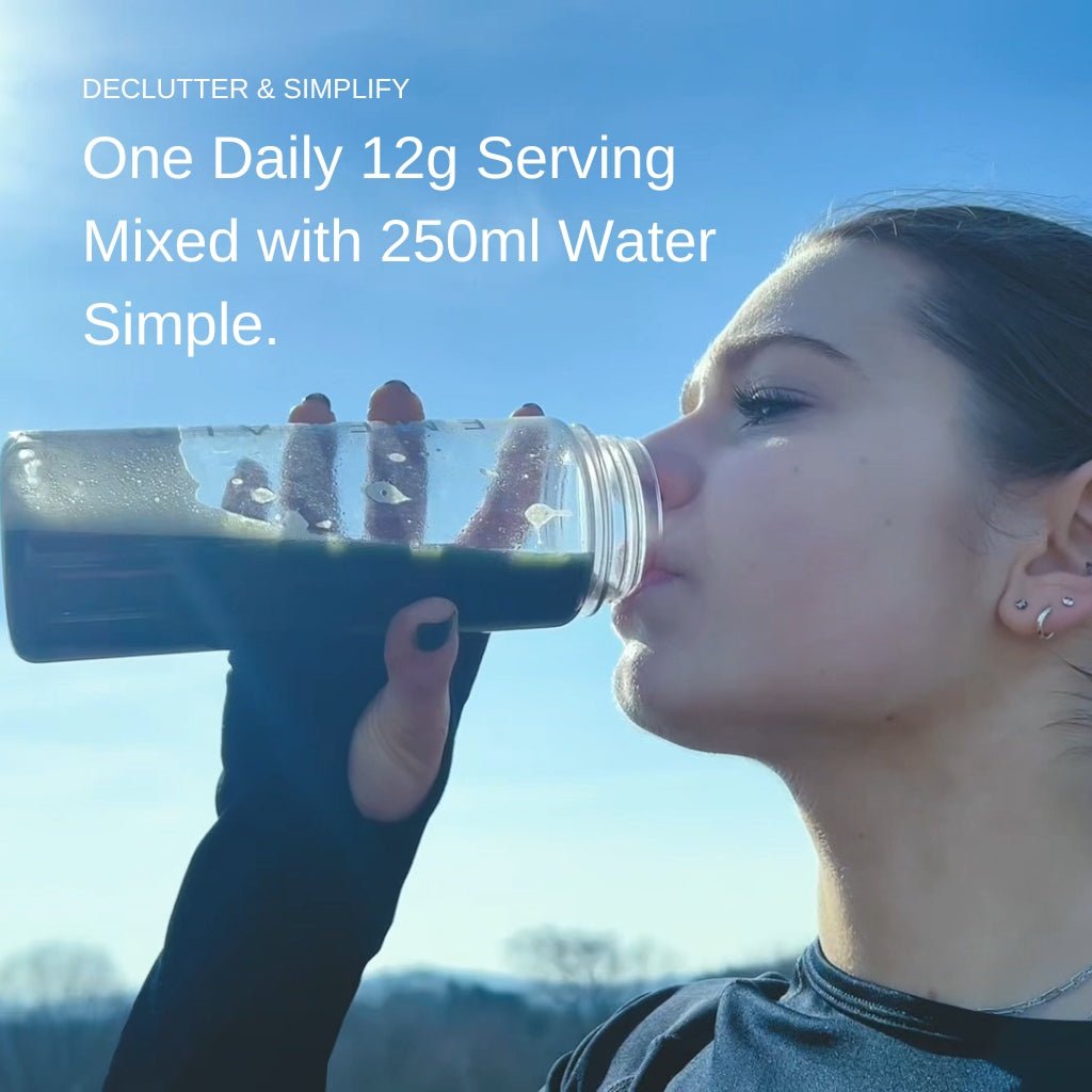 Person drinking from a bottle with text about daily serving size and water mixing.